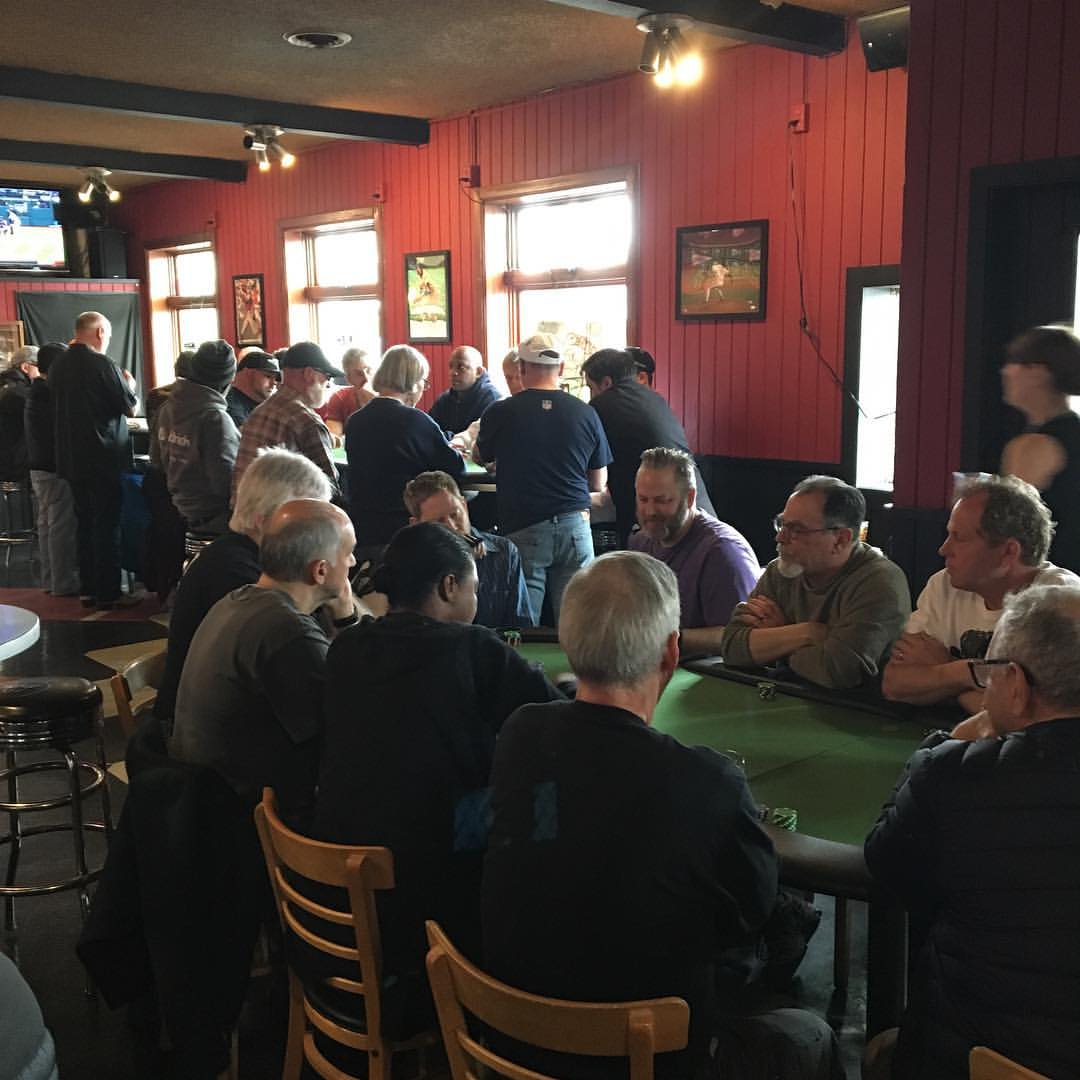 Players gathered around the tables at Cooper's Ale House