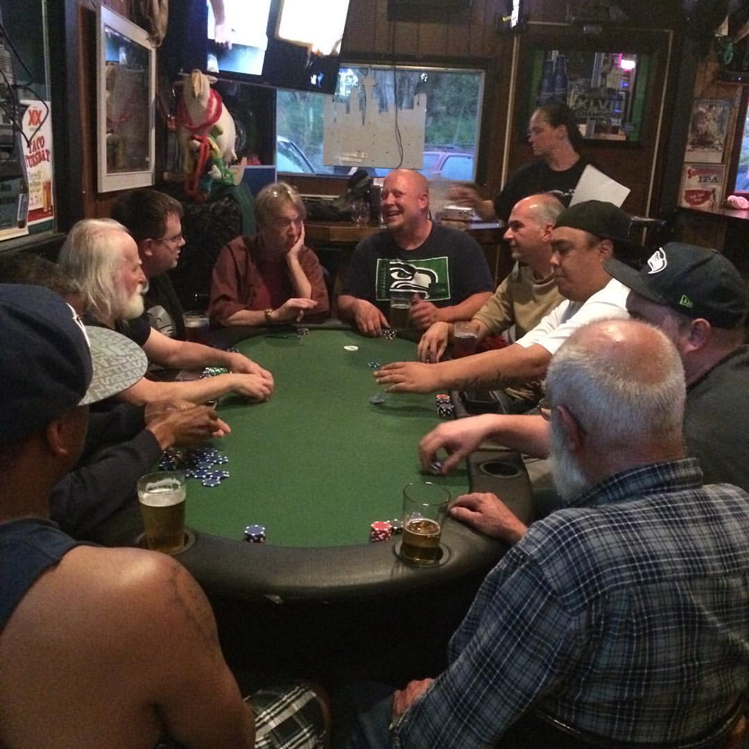 Players around the table at the Tug Inn