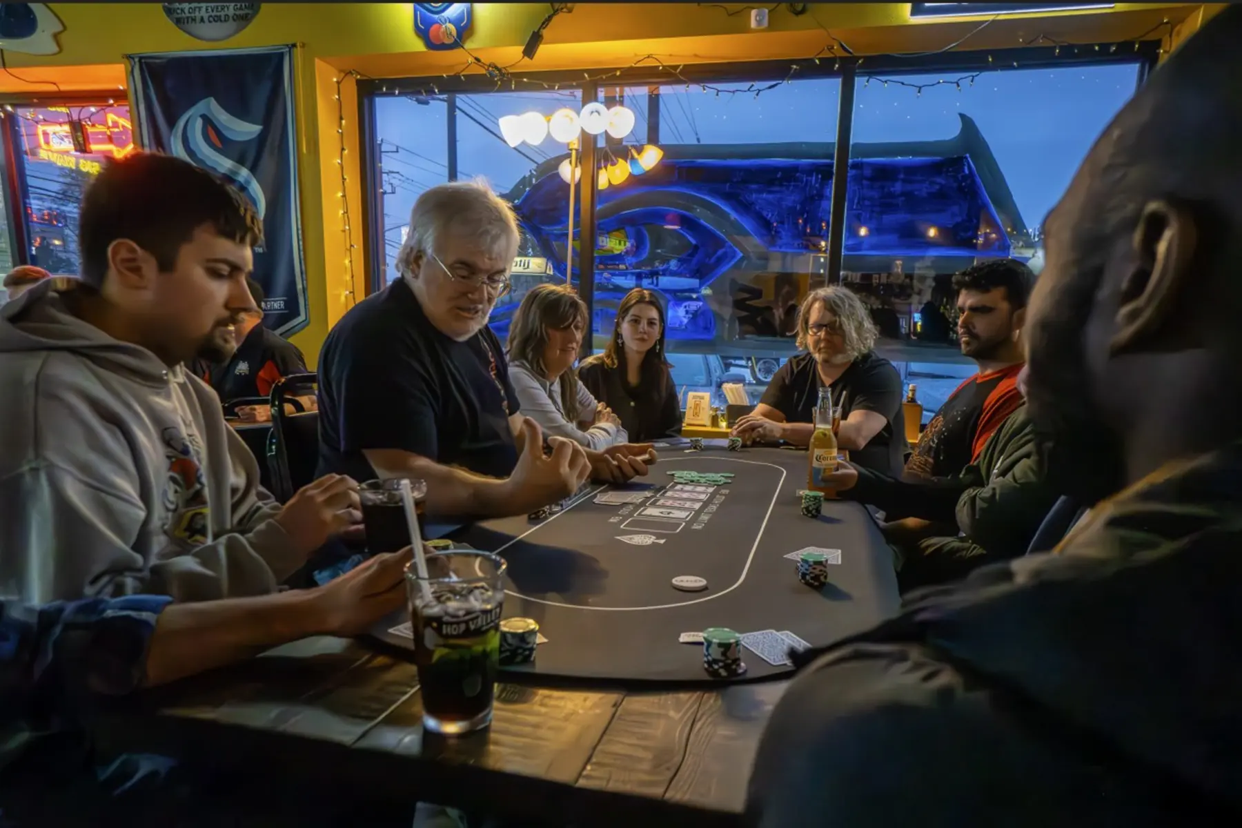 Pocket Eights players gathered around a poker table
